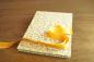 Preview: Leporello with scattered yellow flowers and a yellow bow